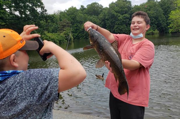 Young Fisherman Catches 20-Pound Carp Central Park