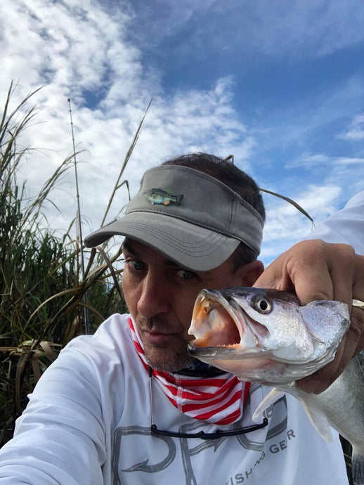 Chris Newburn Takes Selfie With a Fish