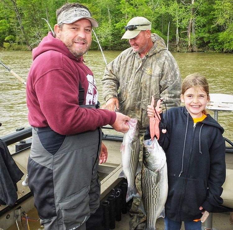 Young Girl Catches First Stripe Bass